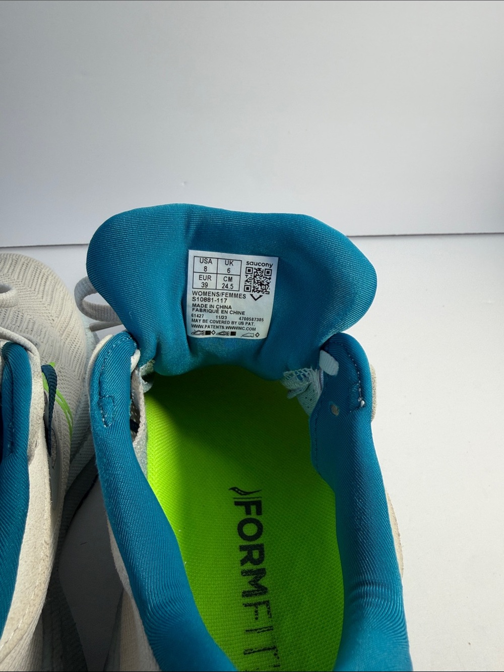 Saucony White Running Shoes with Neon Green and Teal Accents - Picture 9 of 9